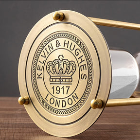 Brass Hourglass equipped with three points, in line with the poles bracing the whole hourglass.